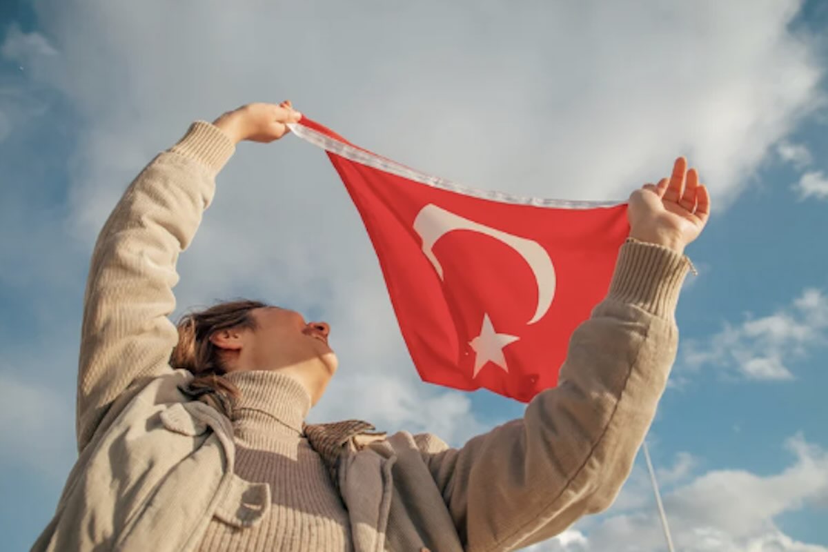 A woman rising a flag